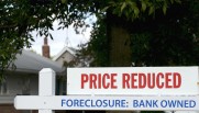 Price reduced sign on house