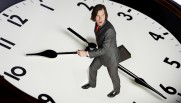 Man running on big clock