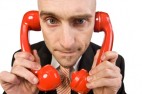 man with telephone on both ears